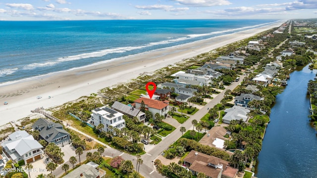 birds eye view of property featuring a residential view, a view of the beach, and a water view