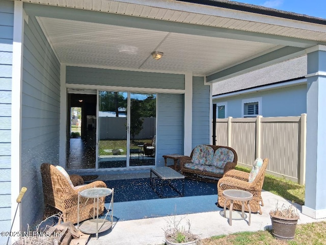 view of patio / terrace featuring fence