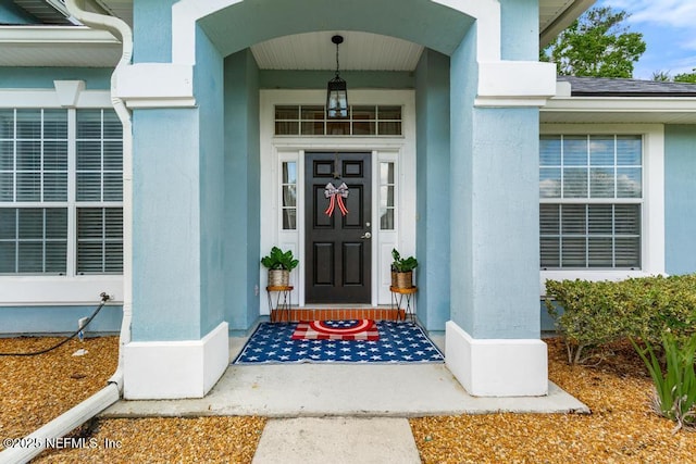 45103 Amhurst Oaks Dr, Callahan, FL 32011 - doorway to property with stucco siding