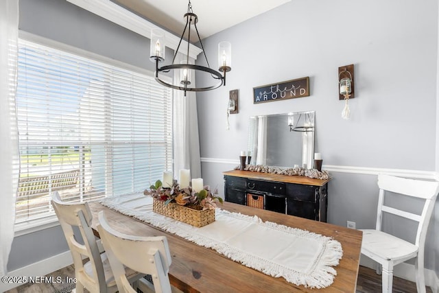 45103 Amhurst Oaks Dr, Callahan, FL 32011 - dining space with a chandelier and baseboards