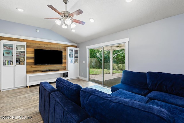 45103 Amhurst Oaks Dr, Callahan, FL 32011 - living room with lofted ceiling, light wood finished floors, a ceiling fan, recessed lighting, and baseboards