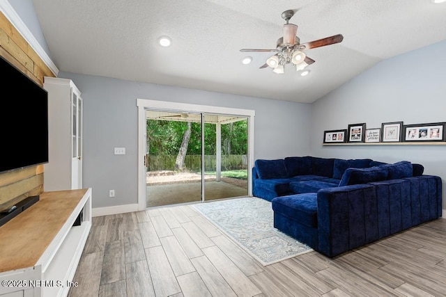 45103 Amhurst Oaks Dr, Callahan, FL 32011 - living area featuring ceiling fan, light wood-type flooring, vaulted ceiling, baseboards, and recessed lighting