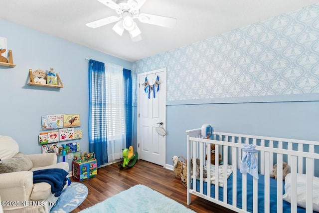45103 Amhurst Oaks Dr, Callahan, FL 32011 - bedroom with wood finished floors, a nursery area, and ceiling fan