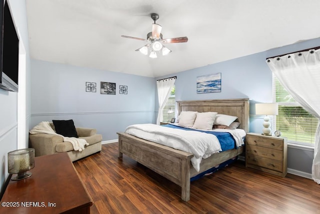 45103 Amhurst Oaks Dr, Callahan, FL 32011 - bedroom with lofted ceiling, wood finished floors, baseboards, and a ceiling fan