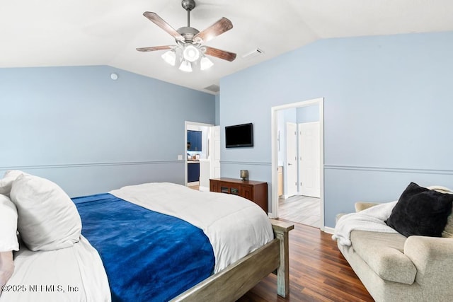 45103 Amhurst Oaks Dr, Callahan, FL 32011 - bedroom with vaulted ceiling, wood finished floors, and a ceiling fan
