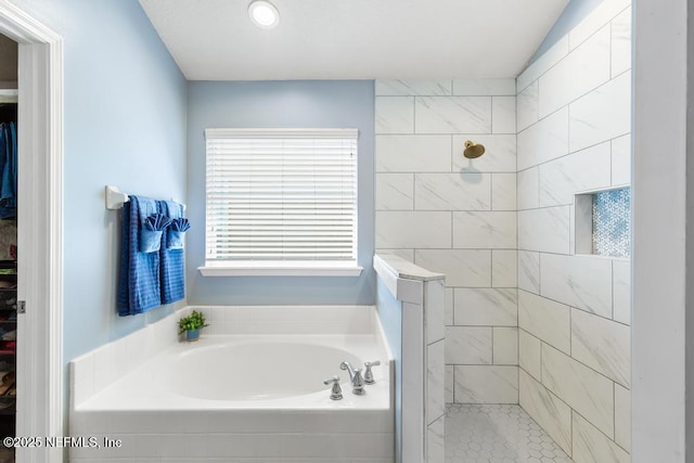 45103 Amhurst Oaks Dr, Callahan, FL 32011 - full bath with a tile shower, a garden tub, and a spacious closet