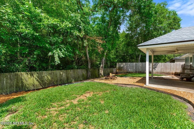 45103 Amhurst Oaks Dr, Callahan, FL 32011 - view of yard featuring ceiling fan and a patio area