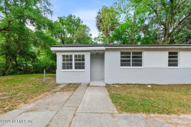 view of front of home with a front yard