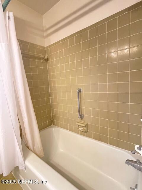 full bathroom with shower / bathtub combination with curtain