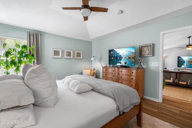 1421 Kipling Ln, Ponte Vedra, FL 32081 - bedroom featuring a textured ceiling, wood finished floors, ceiling fan, and baseboards