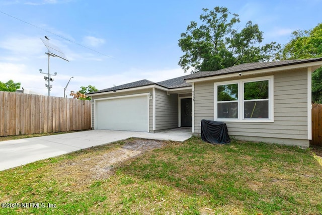 2911 Wilcox St, Jacksonville, FL 32209 - ranch-style home with a garage, fence, and driveway