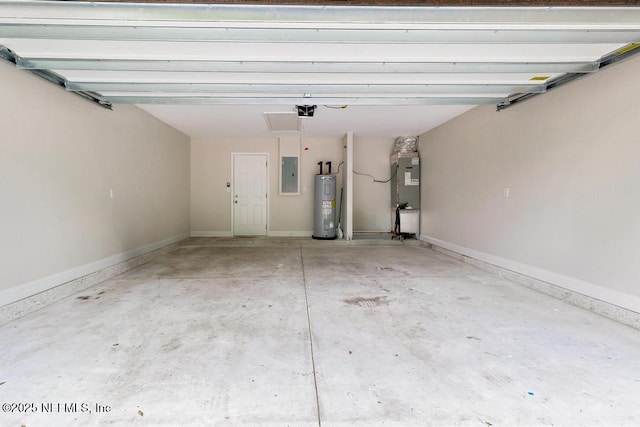 2911 Wilcox St, Jacksonville, FL 32209 - garage featuring baseboards, a garage door opener, electric panel, and electric water heater