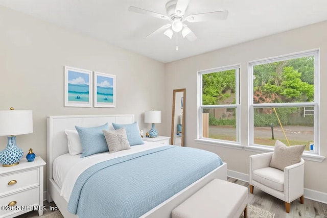 2911 Wilcox St, Jacksonville, FL 32209 - bedroom with baseboards, a ceiling fan, and wood finished floors