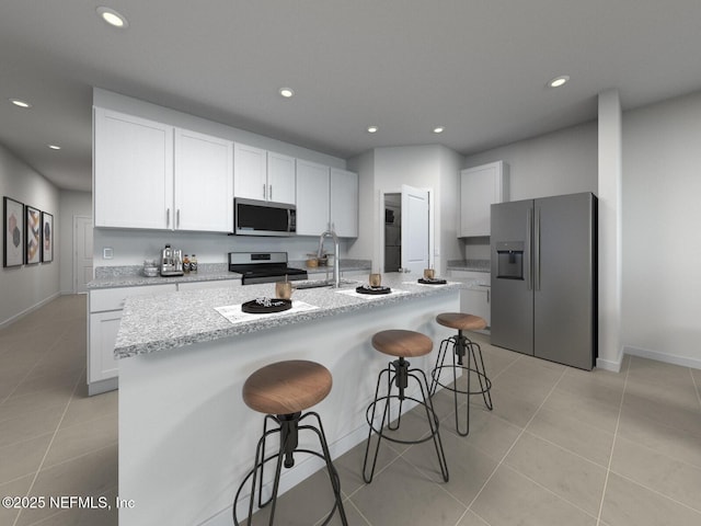 kitchen featuring light tile patterned flooring, a kitchen bar, recessed lighting, a sink, and stainless steel appliances