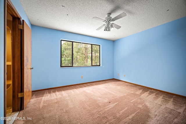 unfurnished bedroom with baseboards, ceiling fan, carpet, and a textured ceiling