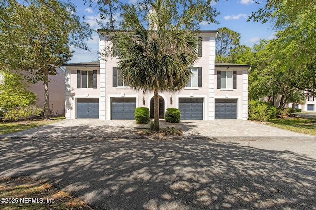 4746 Gulfstream Ct, Fernandina Beach, FL 32034 - view of front of home featuring stucco siding, driveway, and a garage
