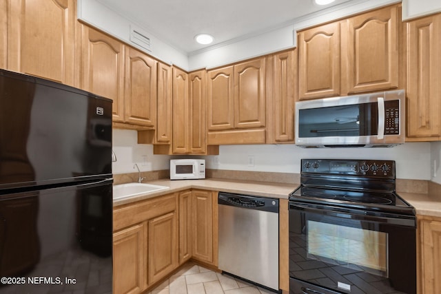 4746 Gulfstream Ct, Fernandina Beach, FL 32034 - kitchen with a sink, black appliances, light countertops, light tile patterned flooring, and recessed lighting