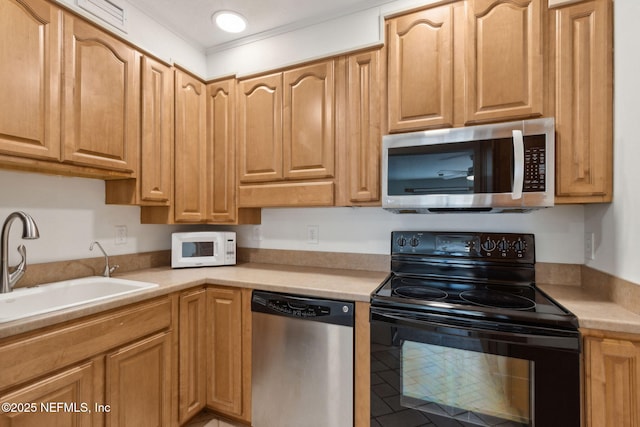 4746 Gulfstream Ct, Fernandina Beach, FL 32034 - kitchen with light countertops, stainless steel appliances, and a sink