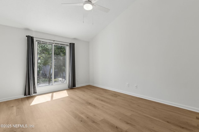 4746 Gulfstream Ct, Fernandina Beach, FL 32034 - empty room with baseboards, light wood finished floors, ceiling fan, and vaulted ceiling
