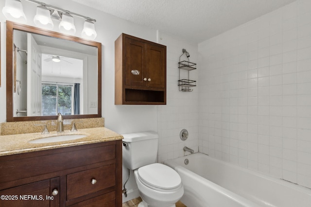 4746 Gulfstream Ct, Fernandina Beach, FL 32034 - bathroom with toilet, a ceiling fan, a textured ceiling, vanity, and shower / bathing tub combination