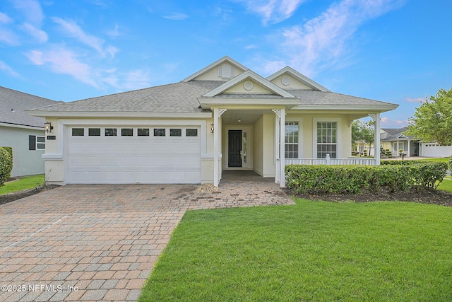 1201 Coghill Cir, Saint Augustine, FL 32092 - single story home featuring stucco siding, decorative driveway, a garage, and a front lawn