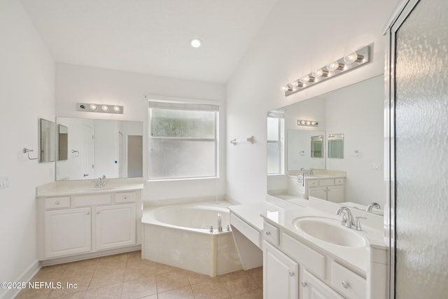 1201 Coghill Cir, Saint Augustine, FL 32092 - bathroom featuring a sink, tile patterned flooring, vaulted ceiling, and a bath