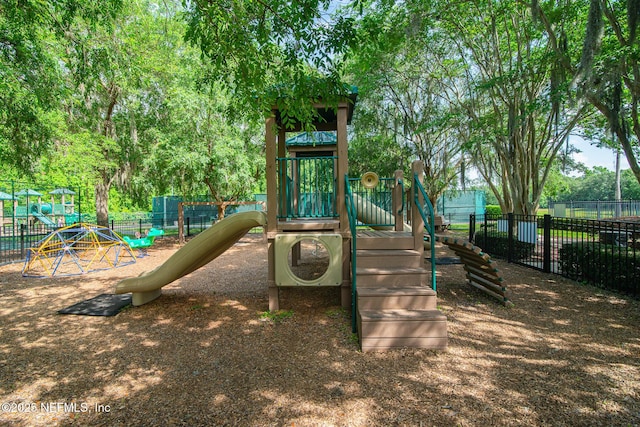 communal playground featuring fence