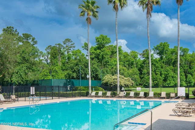 pool featuring a patio and fence