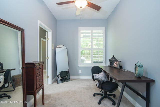office space featuring baseboards, carpet flooring, and ceiling fan