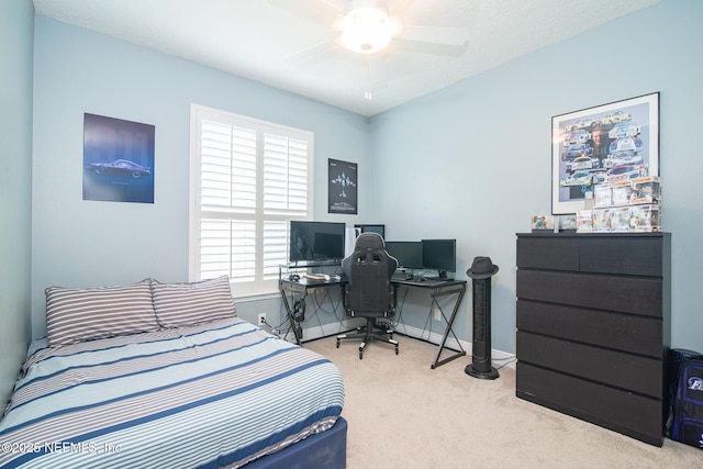 carpeted bedroom with baseboards and ceiling fan