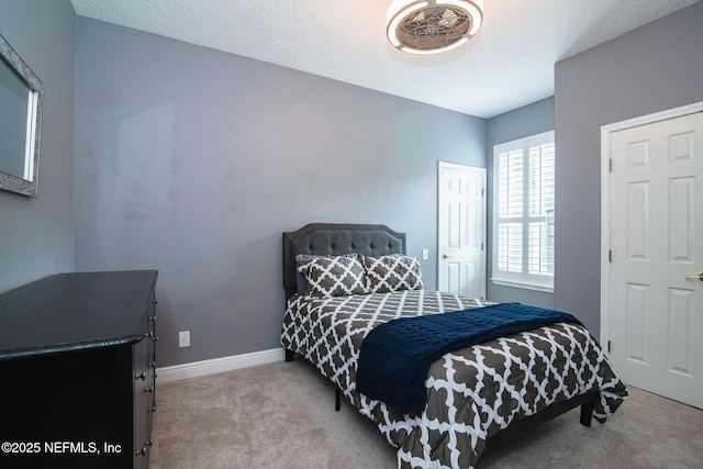 carpeted bedroom with baseboards