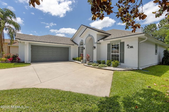 ranch-style house with driveway, a front yard, an attached garage, a shingled roof, and stucco siding