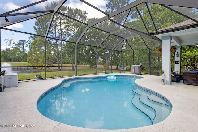 pool featuring a patio, a water view, and glass enclosure