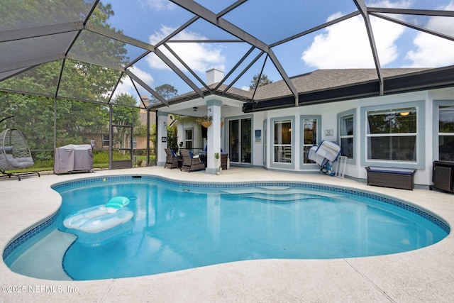 pool featuring a patio, cooling unit, and a lanai