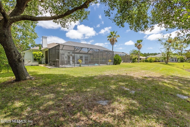 view of yard featuring glass enclosure
