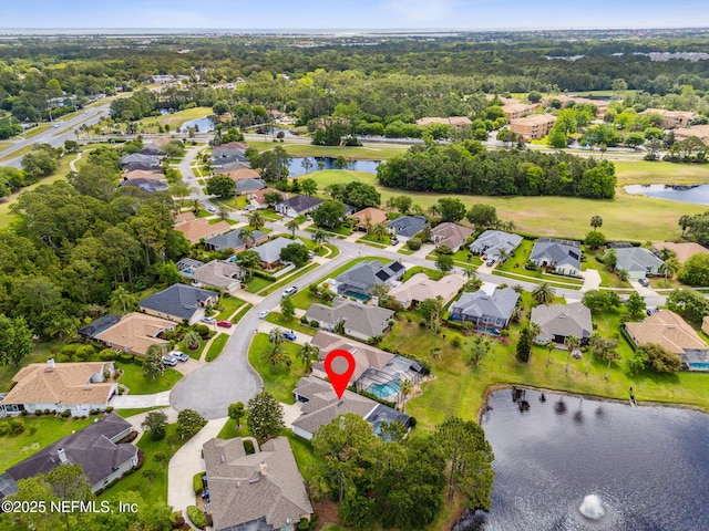 bird's eye view featuring a residential view and a water view