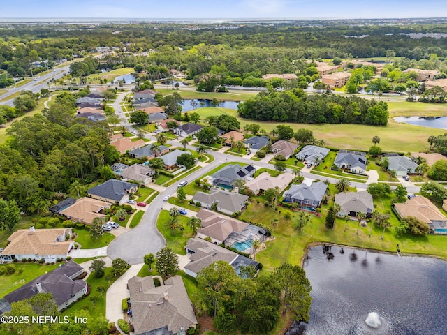 bird's eye view with a water view and a residential view