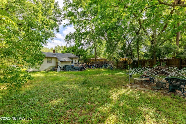 view of yard with fence