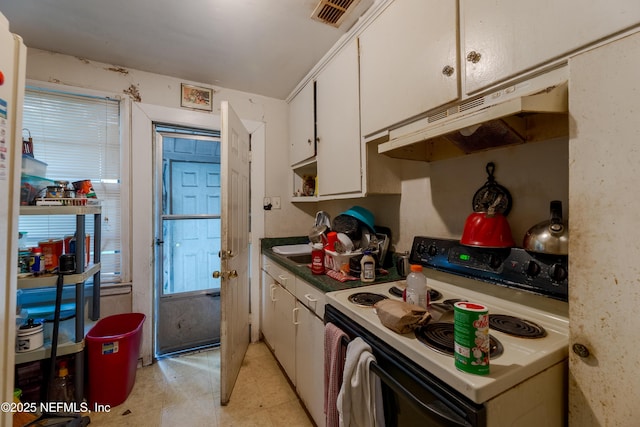 kitchen with white electric stove, visible vents, white cabinets, under cabinet range hood, and light tile patterned flooring