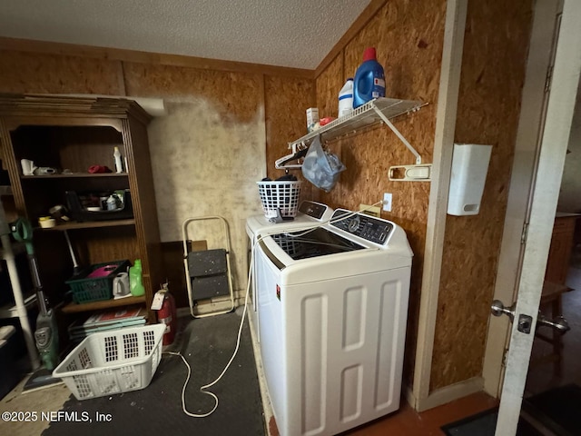 1559 Beecher Ln, Orange Park, FL 32073 - laundry room featuring laundry area, a textured ceiling, and washing machine and clothes dryer