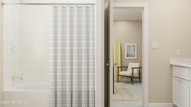 full bathroom featuring vanity and shower / tub combo with curtain