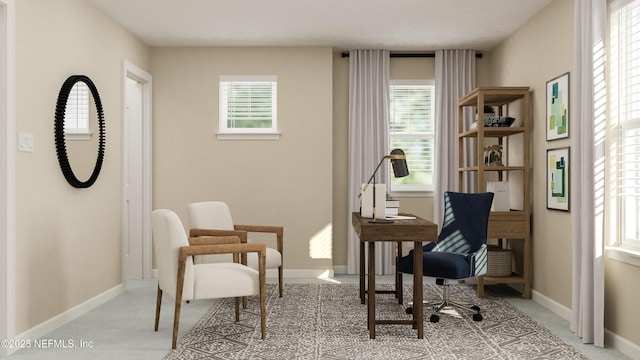 living area with carpet floors, baseboards, and a wealth of natural light