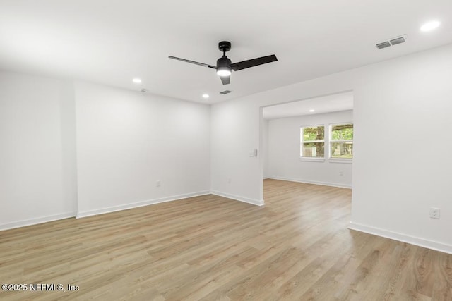 empty room with visible vents, baseboards, recessed lighting, a ceiling fan, and light wood finished floors