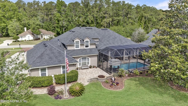 3277 Sequoyah Cir, Saint Johns, FL 32259 - rear view of house with a patio, an outdoor pool, stucco siding, a shingled roof, and a yard