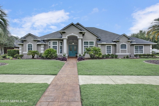 3277 Sequoyah Cir, Saint Johns, FL 32259 - ranch-style house with a shingled roof, a front lawn, and stucco siding