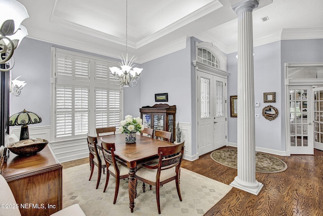 3277 Sequoyah Cir, Saint Johns, FL 32259 - dining room featuring visible vents, ornamental molding, wood finished floors, ornate columns, and a chandelier