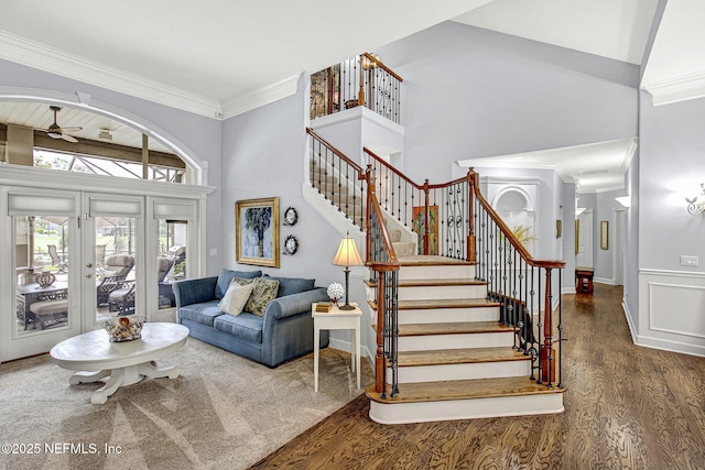 3277 Sequoyah Cir, Saint Johns, FL 32259 - living area featuring a ceiling fan, french doors, wood finished floors, stairway, and a high ceiling