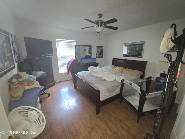 bedroom featuring ceiling fan and wood finished floors