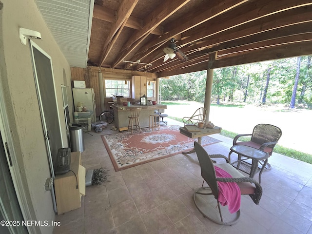 view of patio featuring ceiling fan and outdoor dry bar