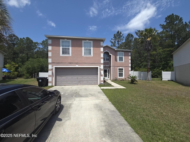 view of front of house with fence, an attached garage, driveway, and a front yard